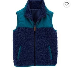 Boys zip up Sherpa vest.
